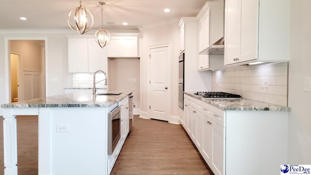 855 Bellemeade Cir, Florence, SC 29501 - kitchen featuring stainless steel gas stovetop, white cabinets, light wood finished floors, recessed lighting, and light stone counters