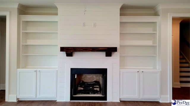 855 Bellemeade Cir, Florence, SC 29501 - detailed view of built in features, ornamental molding, wood finished floors, and a fireplace