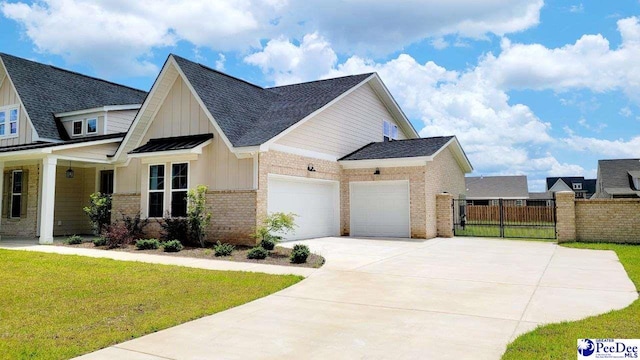 855 Bellemeade Cir, Florence, SC 29501 - view of front of house with board and batten siding, brick siding, an attached garage, concrete driveway, and a shingled roof
