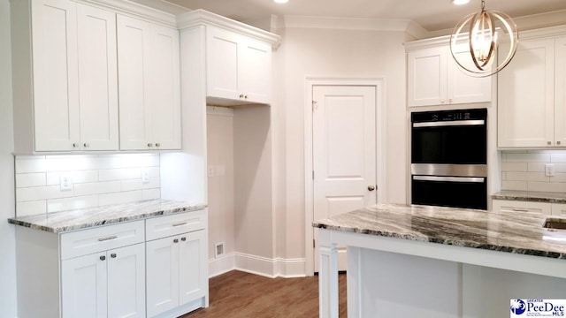 855 Bellemeade Cir, Florence, SC 29501 - kitchen featuring double wall oven, white cabinetry, light stone countertops, backsplash, and recessed lighting