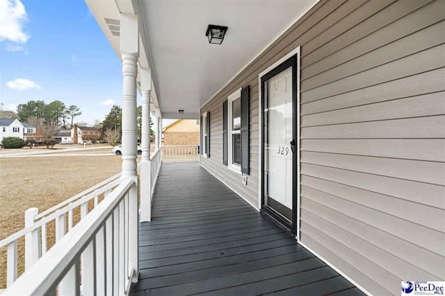 wooden deck featuring a porch