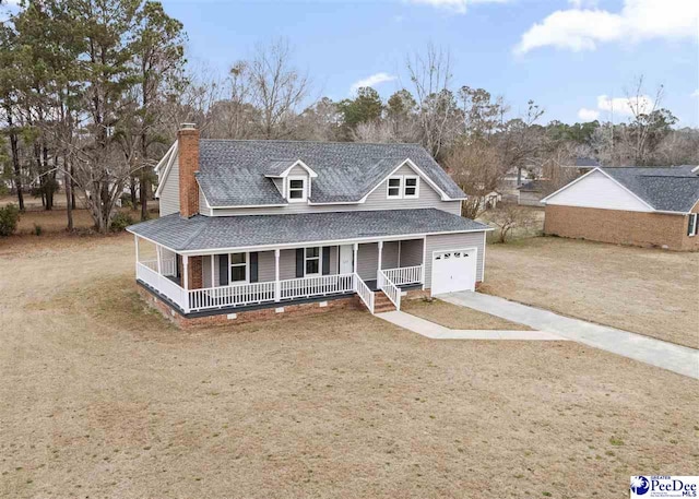 farmhouse-style home featuring a garage, a front lawn, and covered porch