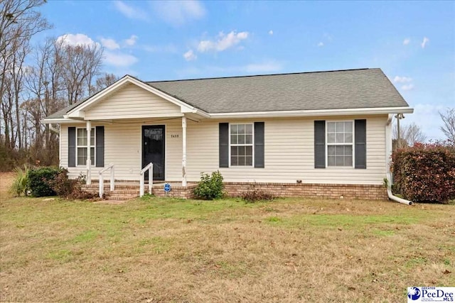 single story home featuring a front lawn