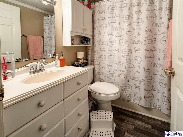 2526 Lester Rd, Dillon, SC 29536 - bathroom featuring ornamental molding, wood finished floors, vanity, toilet, and shower / bath combo