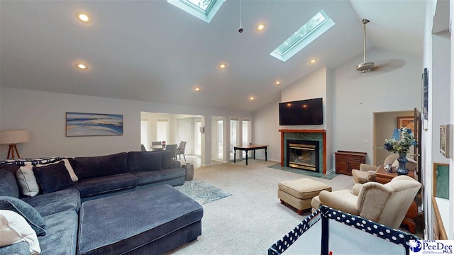 1103 Pine Lake Dr, Hartsville, SC 29550 - living area with a skylight, light colored carpet, high vaulted ceiling, a fireplace with flush hearth, and recessed lighting