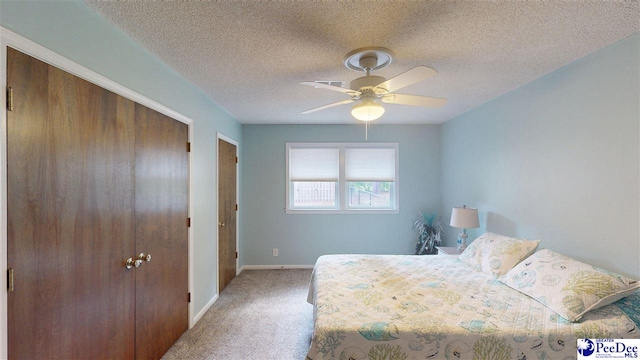 1103 Pine Lake Dr, Hartsville, SC 29550 - carpeted bedroom featuring baseboards, a textured ceiling, and a ceiling fan