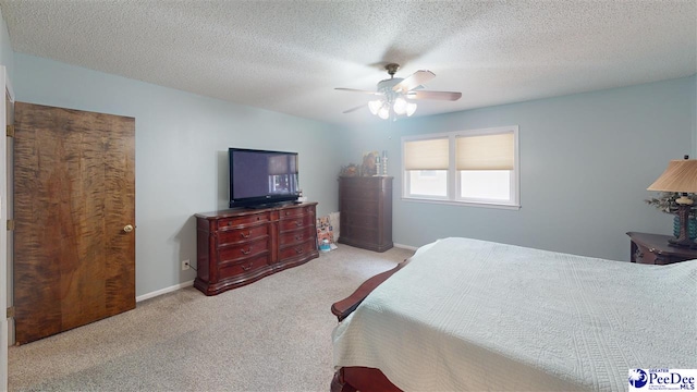 1103 Pine Lake Dr, Hartsville, SC 29550 - carpeted bedroom featuring ceiling fan and a textured ceiling