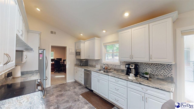 1103 Pine Lake Dr, Hartsville, SC 29550 - kitchen featuring appliances with stainless steel finishes, a sink, under cabinet range hood, decorative backsplash, and white cabinets