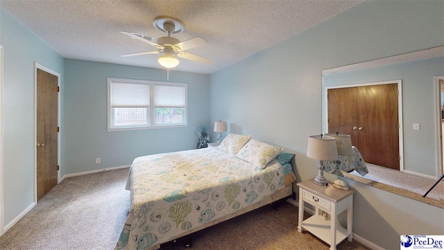 1103 Pine Lake Dr, Hartsville, SC 29550 - bedroom with carpet flooring, a textured ceiling, baseboards, and a ceiling fan