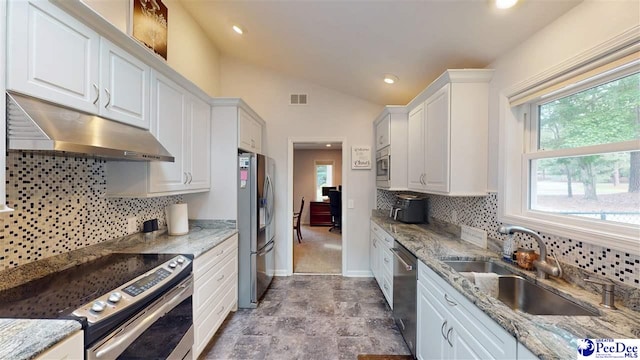 1103 Pine Lake Dr, Hartsville, SC 29550 - kitchen featuring under cabinet range hood, appliances with stainless steel finishes, a sink, white cabinets, and lofted ceiling