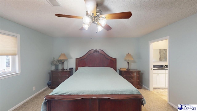1103 Pine Lake Dr, Hartsville, SC 29550 - bedroom with light colored carpet, baseboards, ensuite bath, and a textured ceiling