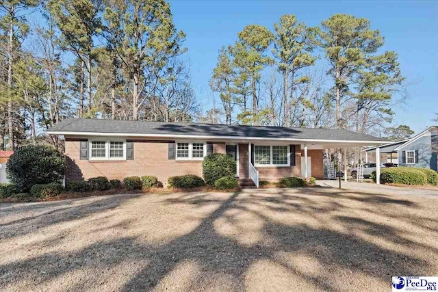 ranch-style home with a carport