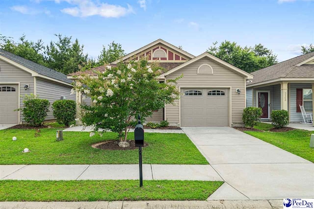 2141 Harbour Ln, Florence, SC 29505 - view of front of house featuring an attached garage, concrete driveway, and a front lawn