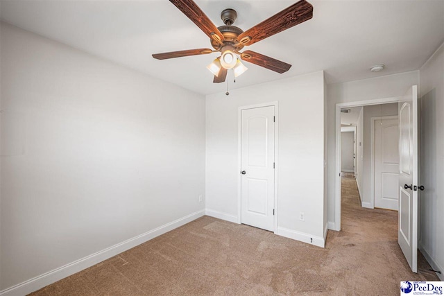 2141 Harbour Ln, Florence, SC 29505 - unfurnished bedroom featuring carpet flooring and a ceiling fan
