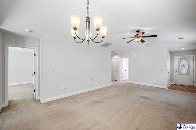 2141 Harbour Ln, Florence, SC 29505 - unfurnished living room featuring light carpet, a ceiling fan, lofted ceiling, a chandelier, and attic access