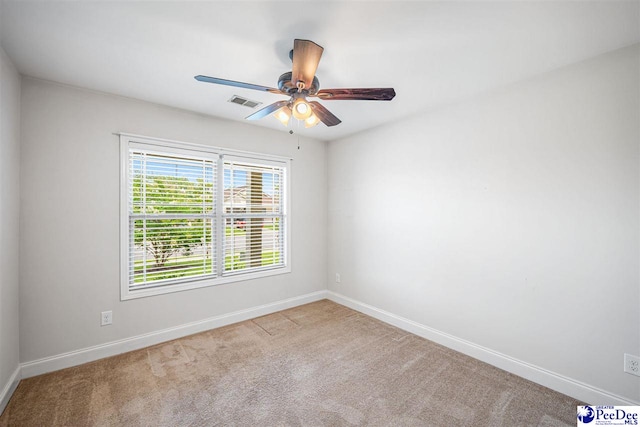 2141 Harbour Ln, Florence, SC 29505 - carpeted spare room with baseboards and a ceiling fan