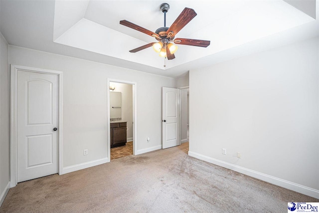 2141 Harbour Ln, Florence, SC 29505 - unfurnished bedroom featuring light colored carpet, connected bathroom, and ceiling fan