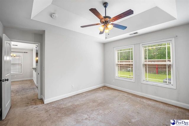 2141 Harbour Ln, Florence, SC 29505 - empty room featuring carpet, a smoke detector, a ceiling fan, and a tray ceiling