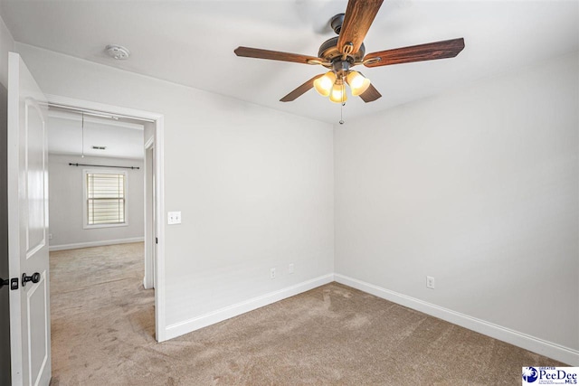 2141 Harbour Ln, Florence, SC 29505 - spare room featuring carpet floors, a smoke detector, and ceiling fan
