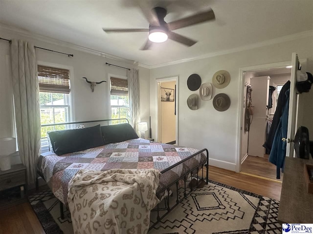 412 W Greene St, Cheraw, SC 29520 - bedroom featuring crown molding, wood finished floors, and a ceiling fan