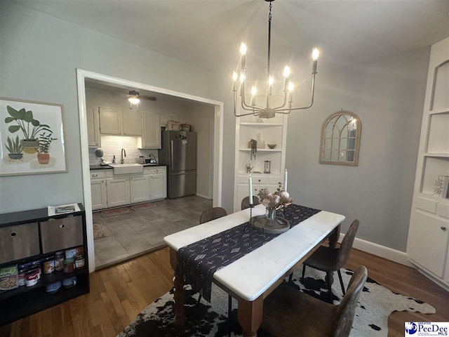 412 W Greene St, Cheraw, SC 29520 - dining area with a chandelier and dark wood finished floors