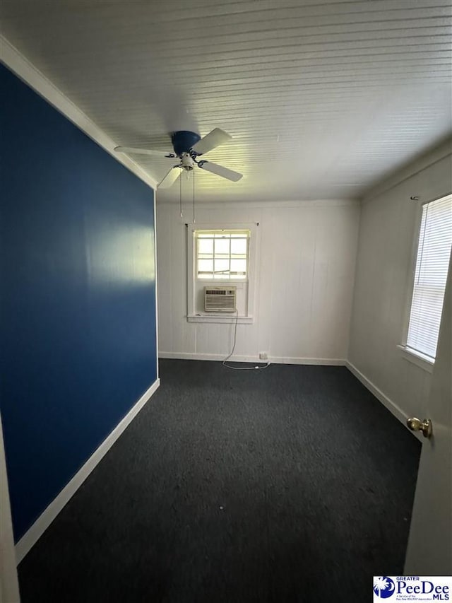 spare room with cooling unit and ceiling fan