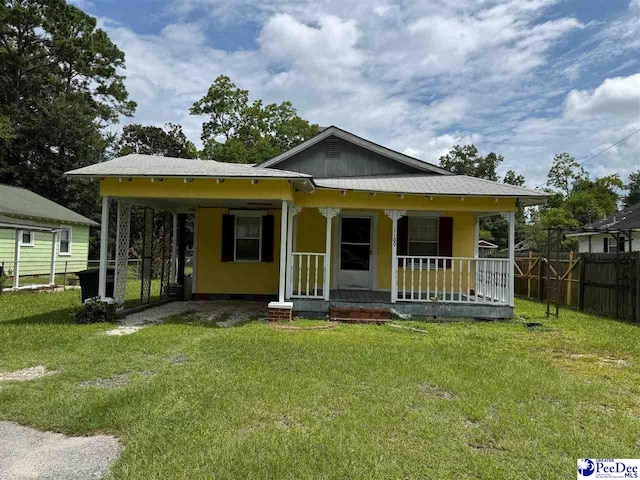 bungalow with a porch and a front yard