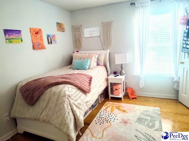 2109UNITG Sanderling, Florence, SC 29501 - bedroom with wood finished floors and baseboards