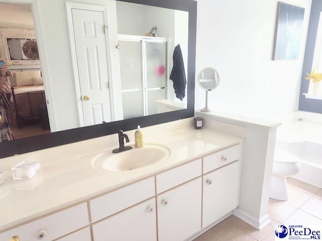 2109UNITG Sanderling, Florence, SC 29501 - bathroom with tile patterned flooring, vanity, a stall shower, toilet, and a bathtub