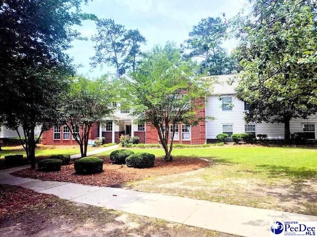2109UNITG Sanderling, Florence, SC 29501 - obstructed view of property with a front yard and brick siding