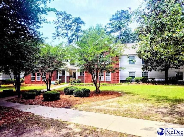2109UNITG Sanderling, Florence, SC 29501 - obstructed view of property with a front yard and brick siding