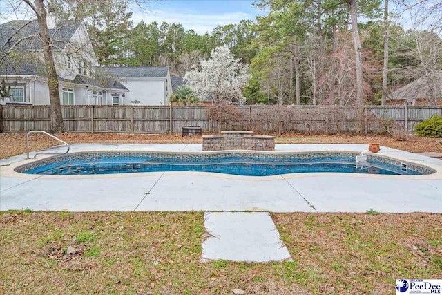 view of swimming pool with a fenced in pool, a fenced backyard, and a hot tub