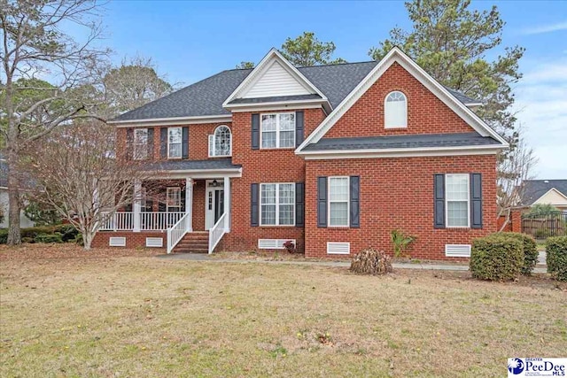 view of front of house with roof with shingles, a porch, a front lawn, crawl space, and brick siding