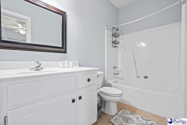 bathroom featuring tile patterned floors, toilet, a ceiling fan, bathtub / shower combination, and vanity