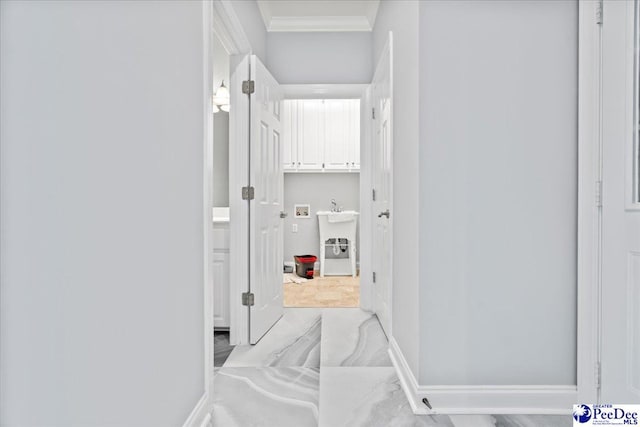 corridor with crown molding and baseboards