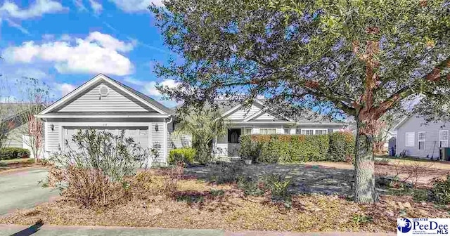 view of front of property featuring driveway and an attached garage