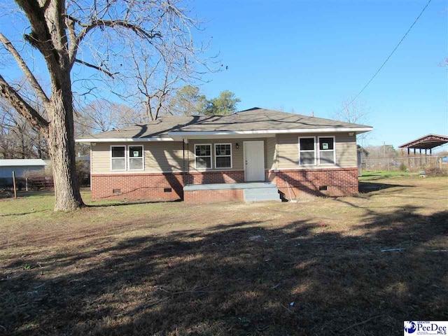 ranch-style house with a front yard