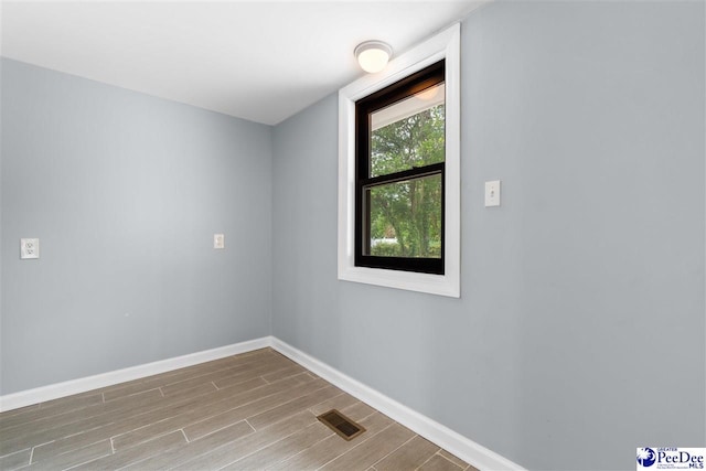 unfurnished room featuring light hardwood / wood-style floors