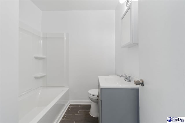 full bathroom featuring bathtub / shower combination, vanity, and toilet