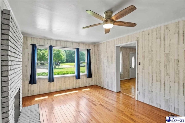 317 Thomas St, Bennettsville, SC 29512 - empty room with hardwood / wood-style floors and a ceiling fan