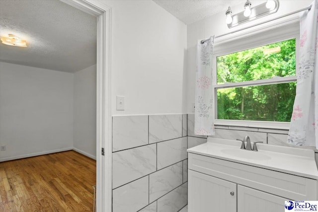 317 Thomas St, Bennettsville, SC 29512 - bathroom featuring a textured ceiling, wood finished floors, and vanity