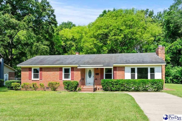317 Thomas St, Bennettsville, SC 29512 - single story home with a front lawn, brick siding, a chimney, and crawl space