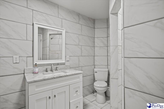 317 Thomas St, Bennettsville, SC 29512 - bathroom featuring tile walls and vanity