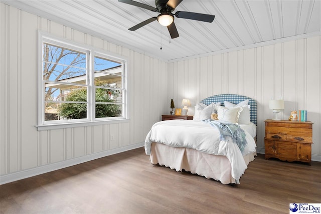 bedroom with wood finished floors and a ceiling fan