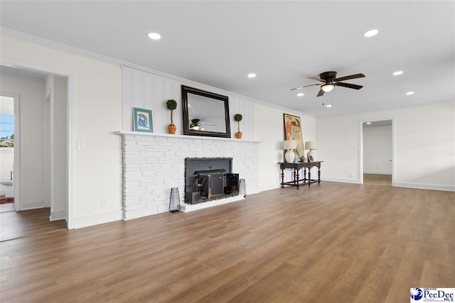 unfurnished living room with recessed lighting, crown molding, a ceiling fan, and wood finished floors