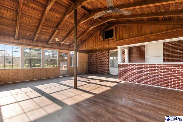 unfurnished sunroom featuring wood ceiling, lofted ceiling with beams, and a ceiling fan