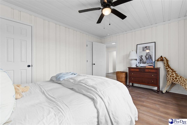 bedroom featuring ornamental molding, ceiling fan, and wood finished floors