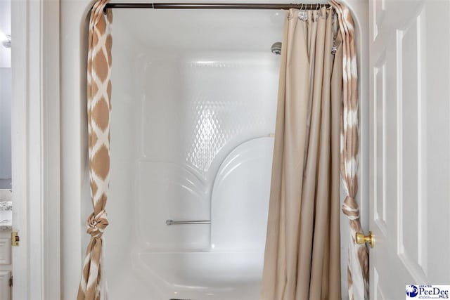 bathroom with a shower with shower curtain