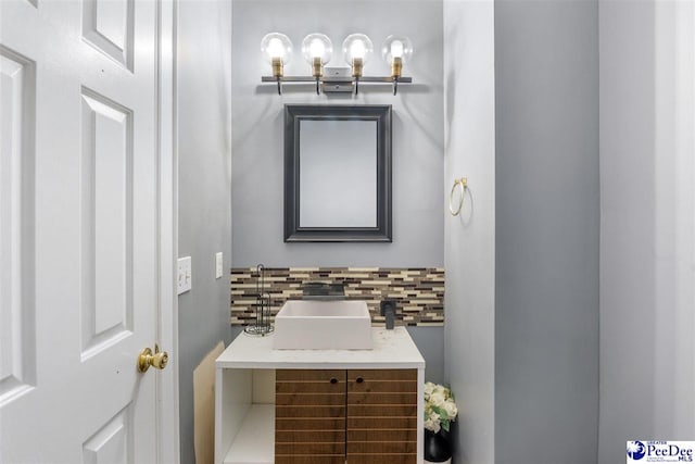 bathroom with decorative backsplash and vanity