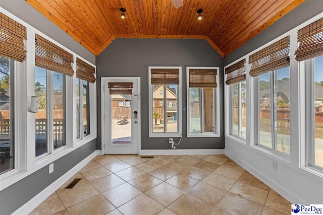 unfurnished sunroom featuring vaulted ceiling, wood ceiling, and visible vents